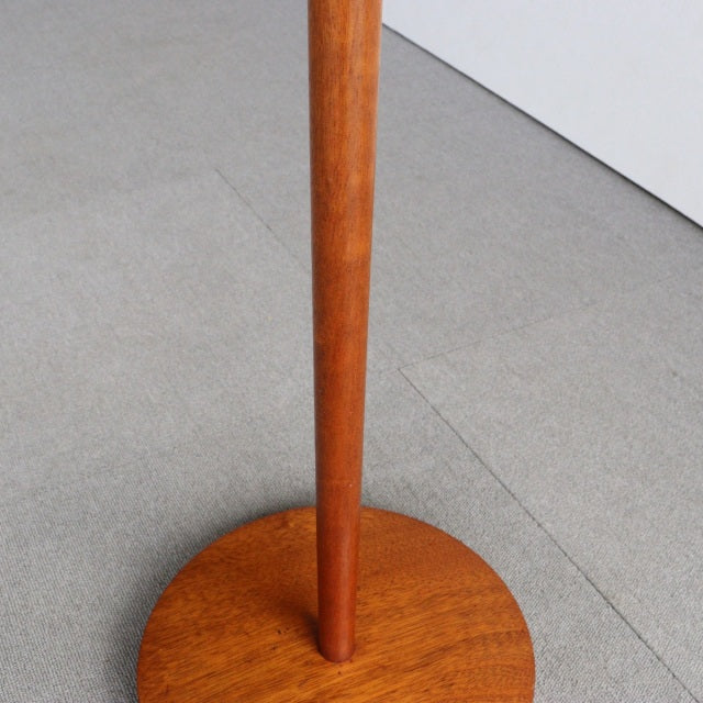 Mid-century British vintage floor lamp base in teak with warm wood grain and slender round leg.