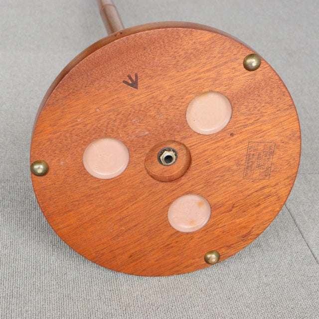 Round vintage teak floor lamp base with visible wood grain, brass screws, and mid-century British design details.