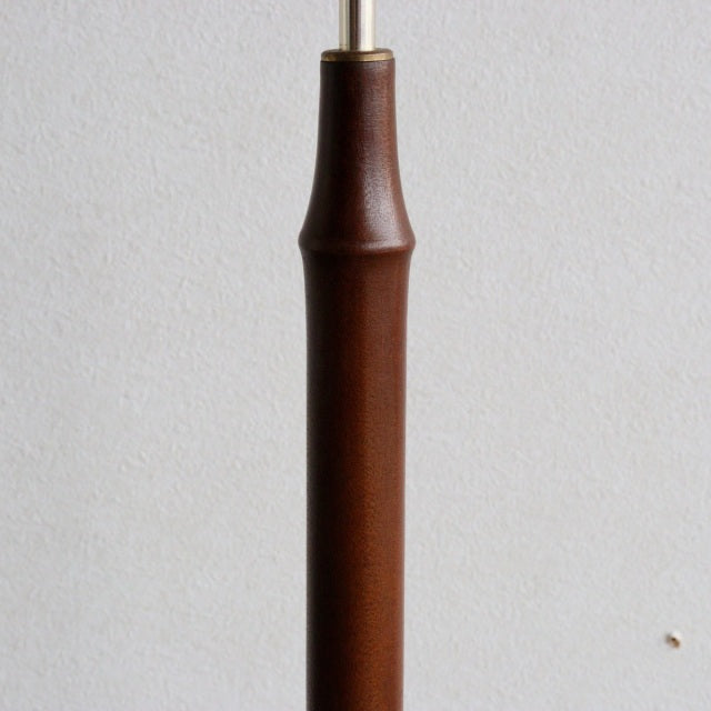 Vintage teak floor lamp base with smooth cylindrical form and mid-century British design.