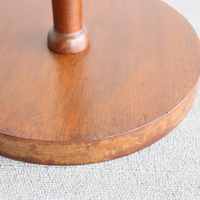 Round teak wood base with smooth grain and warm mid-century British vintage finish.