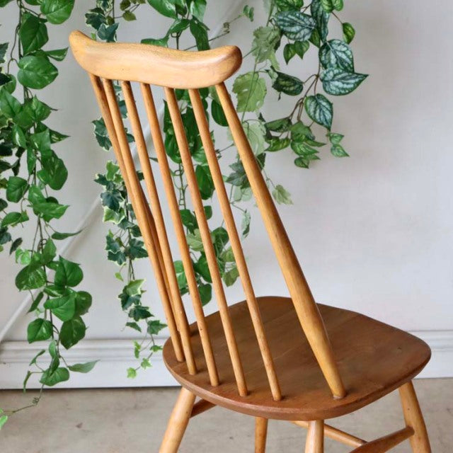 Vintage Arcol Goldsmith high-back dining chair in natural teak with slender vertical spindles and gently curved top rail,.