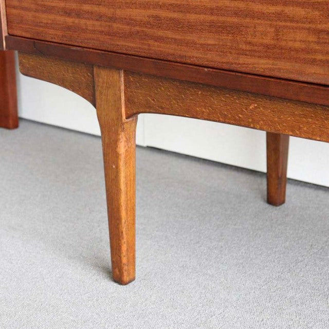 Mid-century British teak sideboard leg with visible wood grain and tapered design from Nathan furniture.
