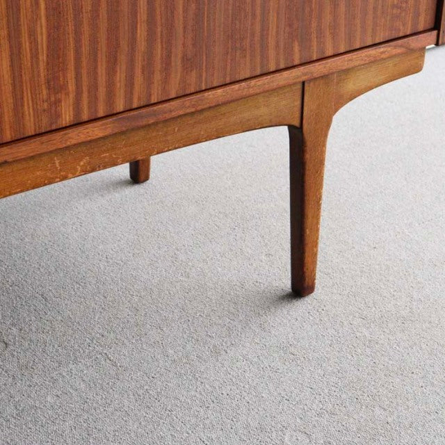 Mid-century British teak sideboard leg with tapered design and rich wood grain by Nathan from Denmark vintage collection.