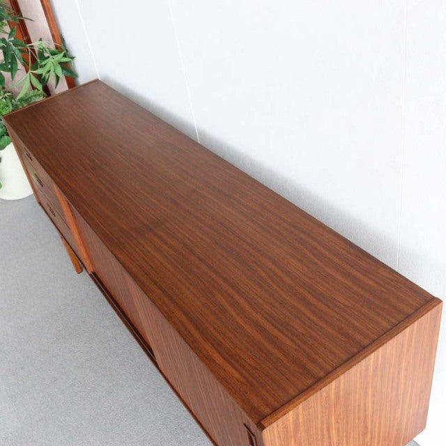 Mid-century British vintage teak sideboard by Nathan with rich wood grain and clean lines.