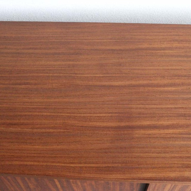 Vintage teak sideboard top with rich wood grain, smooth finish from British mid-century Nathan furniture.