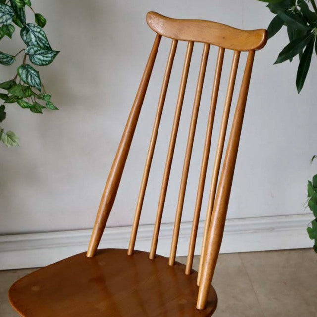 Vintage British mid-century Arcol Goldsmith high-back chair in natural teak with slender vertical spindles and curved top.