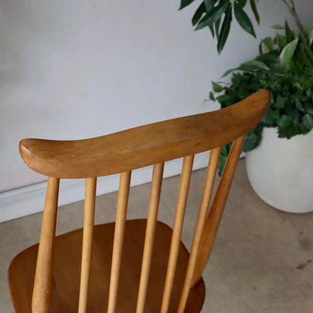 Vintage Ercol Goldsmith teak high-back dining chair with mid-century British design, smooth wood grain and tapered legs.