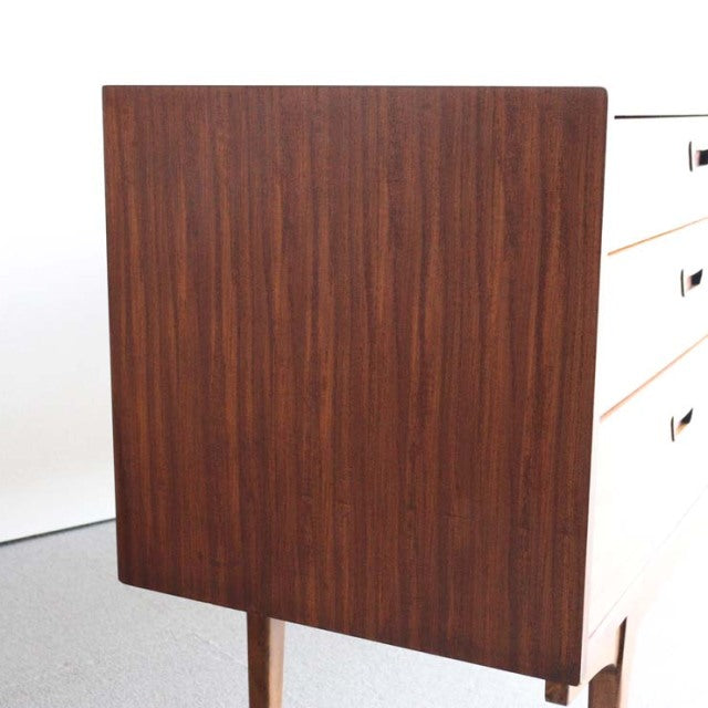 Mid-century British vintage teak sideboard by Nathan with rich wood grain and slender tapered legs.