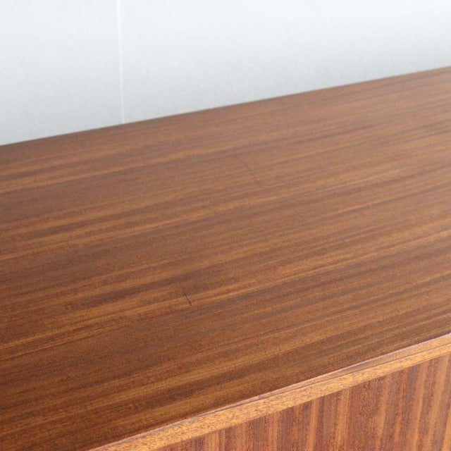 Vintage teak sideboard top surface showing rich wood grain, mid-century British design by Nathan.