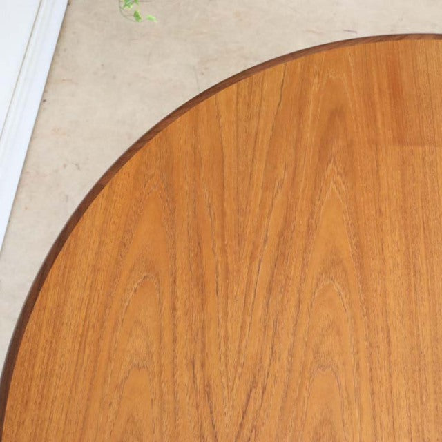 Oval vintage teak dining table top with smooth wood grain, British mid-century style.