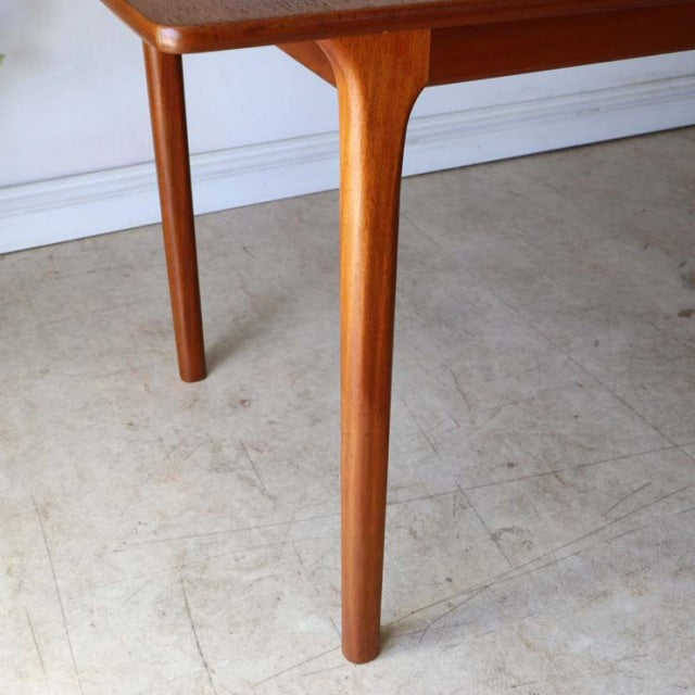 Vintage British mid-century teak dining table leg with smooth rounded edges and fine wood grain from McIntosh.