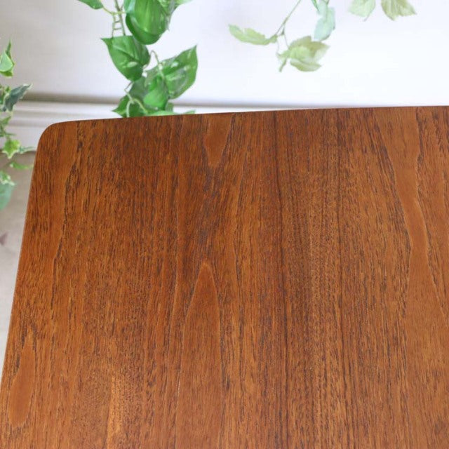 Vintage teak dining table top with rich wood grain and smooth finish, British mid-century style.