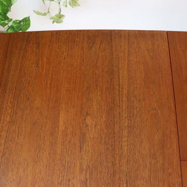Vintage British McIntosh mid-century teak dining table top showing rich wood grain and smooth finish.