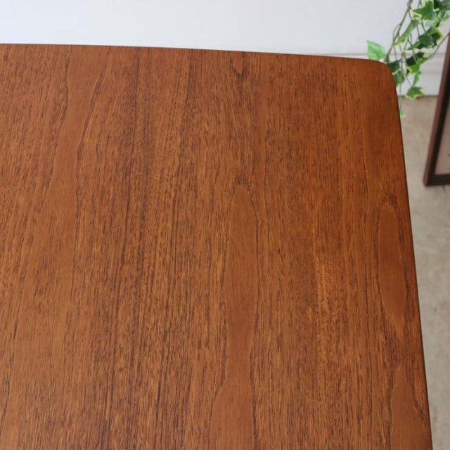 Vintage mid-century British teak dining table top with rich wood grain and rounded corners, smooth polished finish.