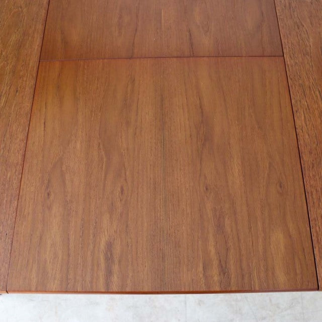 Square vintage British teak dining table top with rich wood grain and mid-century craftsmanship.