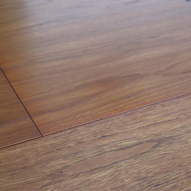 Vintage British mid-century teak dining table with smooth wood grain and clean rectangular edges.