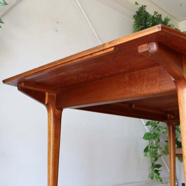Vintage mid-century teak dining table by McIntosh, British design with clean rectangular form and tapered legs.