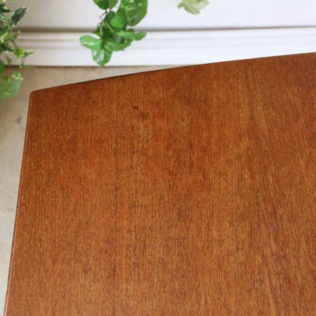 Vintage McIntosh teak dining table top with rich wood grain and warm mid-century British design.