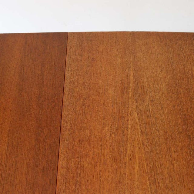 Mid-century vintage British teak dining table top with rich wood grain and smooth finish.