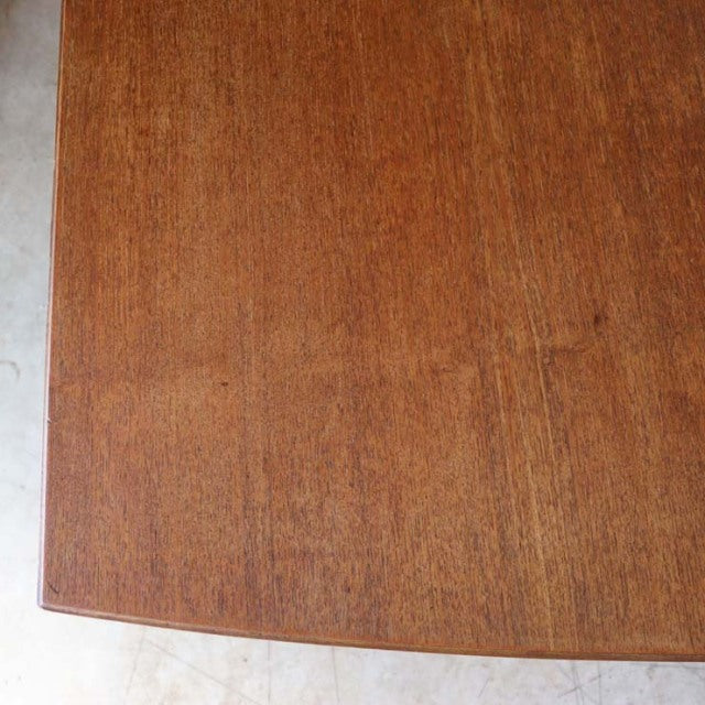 Vintage British mid-century teak dining table top with rich wood grain, smooth finish, and rounded edges.