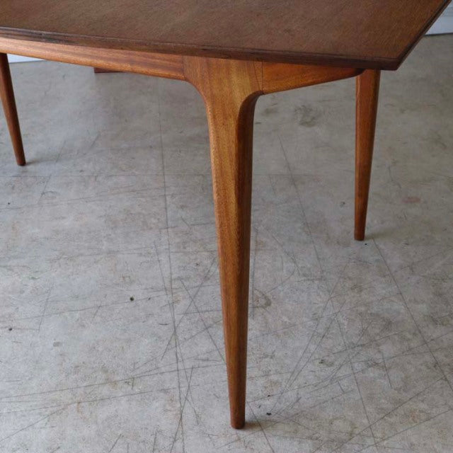 Mid-century British vintage McIntosh dining table leg in teak with smooth grain and tapered form.