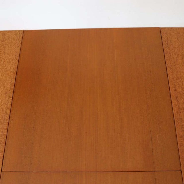 Vintage teak mid-century British McIntosh dining table with rich wood grain and clean rectangular form.