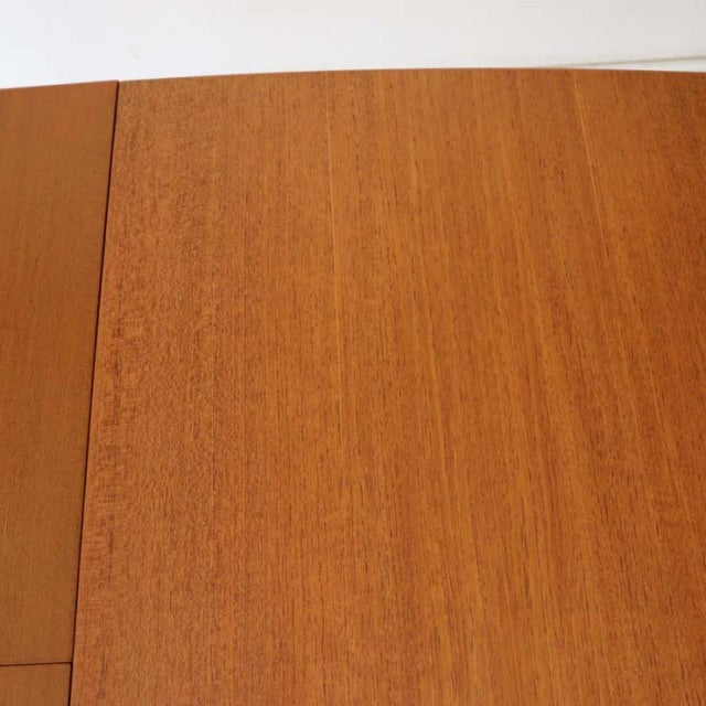Vintage mid-century teak dining table top with warm British wood grain, smooth rectangular surface.