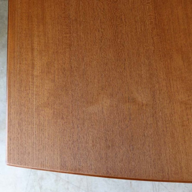 Vintage teak McIntosh dining table top with rich wood grain and mid-century British design.