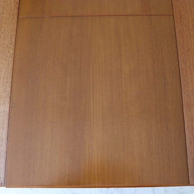Vintage McIntosh mid-century teak dining table top with smooth wood grain and rectangular form.