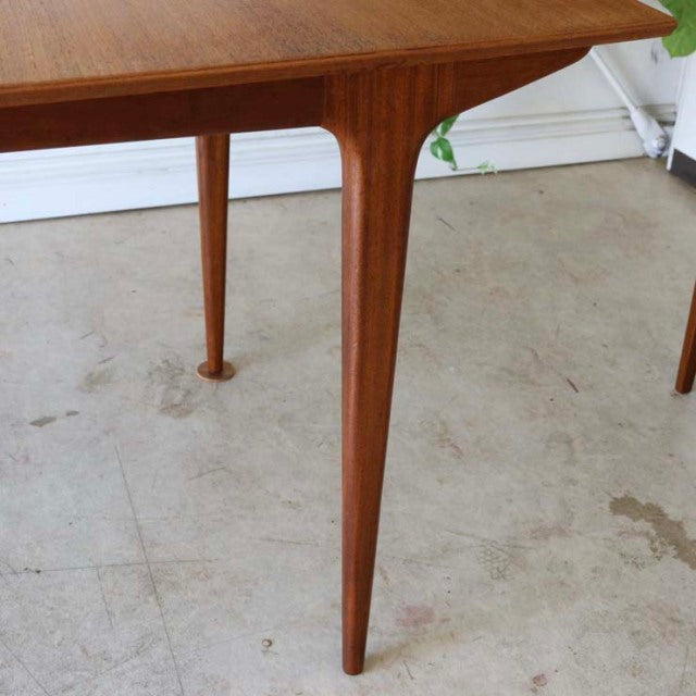 Vintage teak McIntosh dining table leg with tapered mid-century British design and smooth wood grain finish.