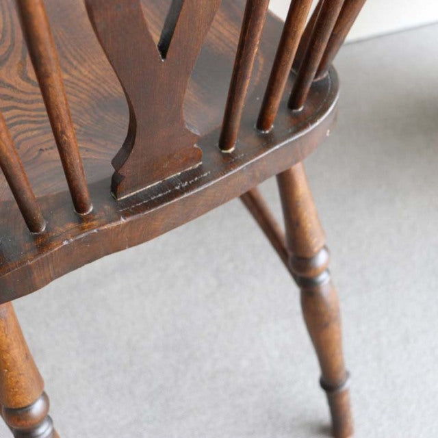 Vintage British teak kitchen chair with turned legs and spindle backrest, mid-century Denmark style.