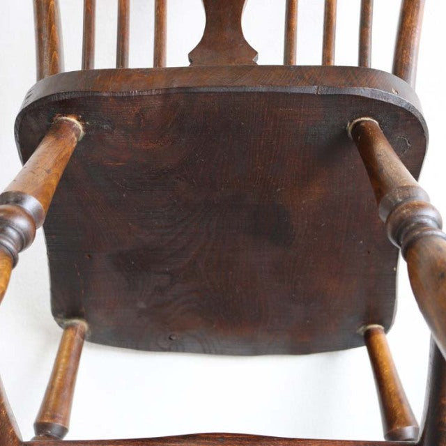 Vintage British mid-century teak kitchen chair with visible wood grain and turned legs from Denmark.