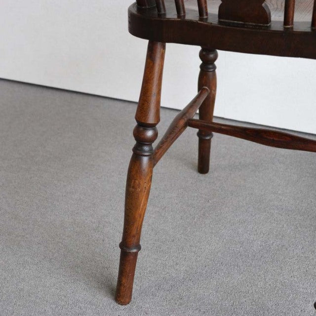 Vintage British teak mid-century kitchen chair leg with rich wood grain and turned detailing.