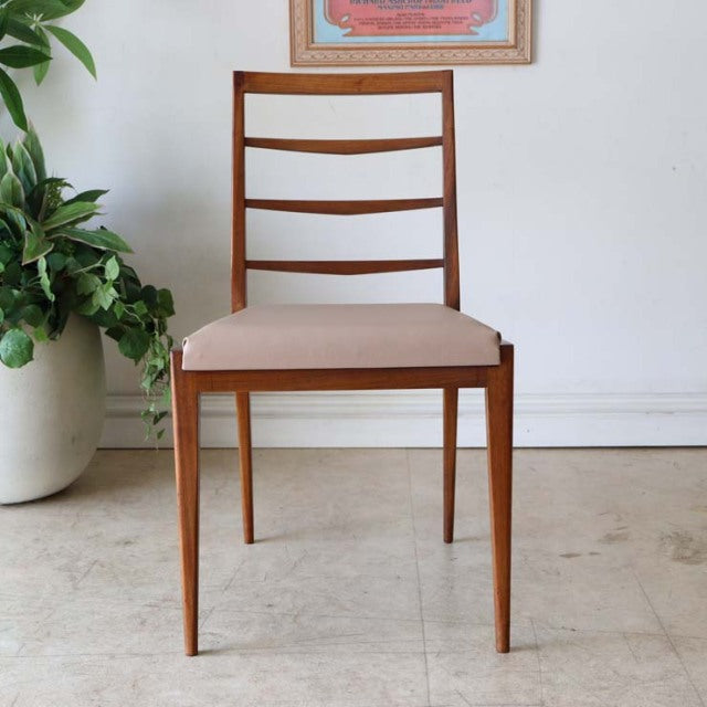 Set of four British vintage McIntosh mid-century dining chairs in teak with ladder backs and beige upholstered seats,.