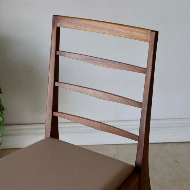 Vintage McIntosh teak dining chair with mid-century British design, slatted backrest, beige seat cushion.