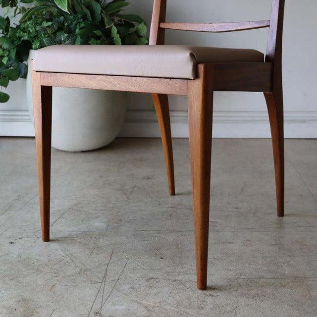 Set of four vintage teak dining chairs by McIntosh, British mid-century design with slender tapered legs and beige.