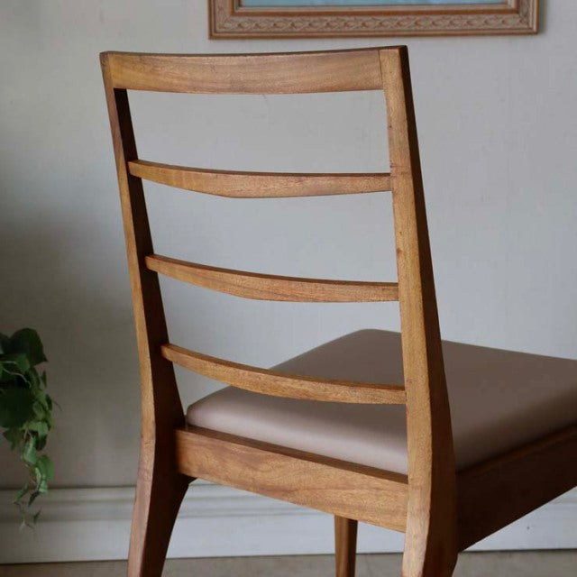 Set of four vintage teak McIntosh dining chairs with ladder back design, mid-century British style, smooth wood grain and.