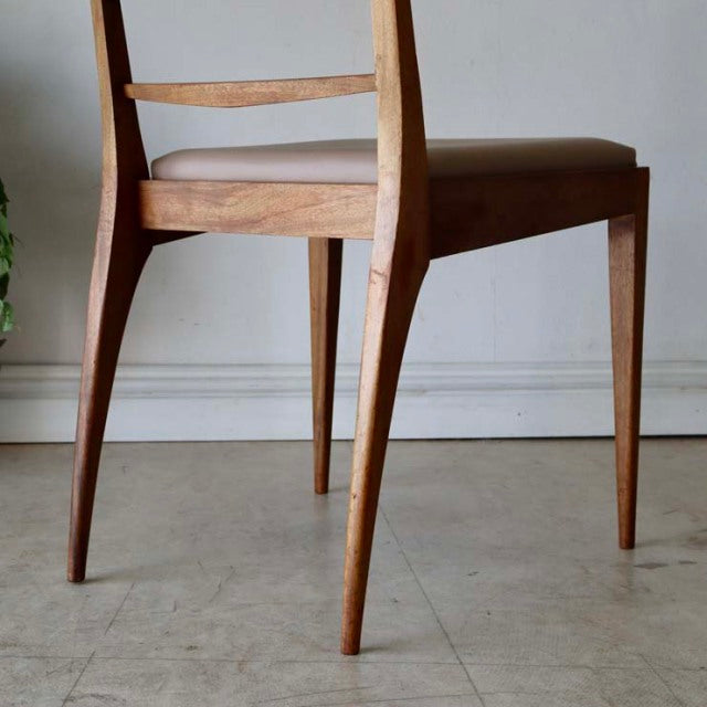Mid-century vintage teak dining chair by McIntosh with slender tapered legs and curved backrest, showcasing British-Danish.