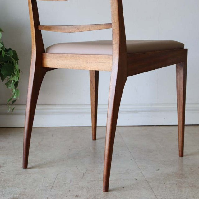 Mid-century British vintage teak dining chair by McIntosh with slender tapered legs and curved backrest detailing.