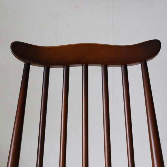 Vintage British ERCOL Goldsmith highback dining chair in rich teak with slender vertical spindles and smooth curved top rail.