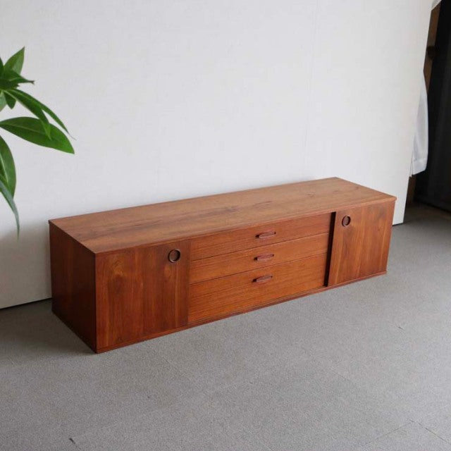 Vintage mid-century teak sideboard by Avalon, British-Denmark design with rich wood grain and sleek drawers.