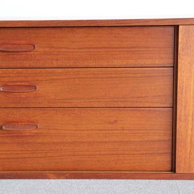 Vintage teak mid-century sideboard by AVALON with British-Danish design, smooth wood grain, and integrated handles.
