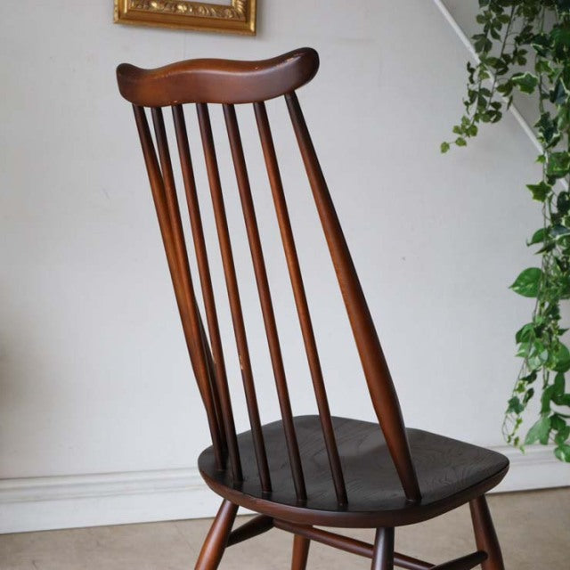 ERCOL Goldsmith Highback Windsor chair in vintage teak with British mid-century design, slender spindled back and tapered.