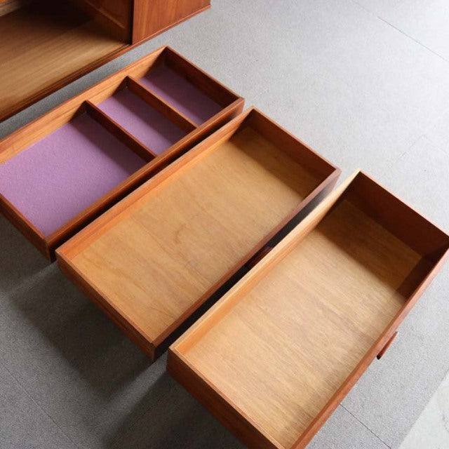 Vintage teak sideboard drawers by Avalon with distinctive British mid-century design, showing smooth wood grain and clean.