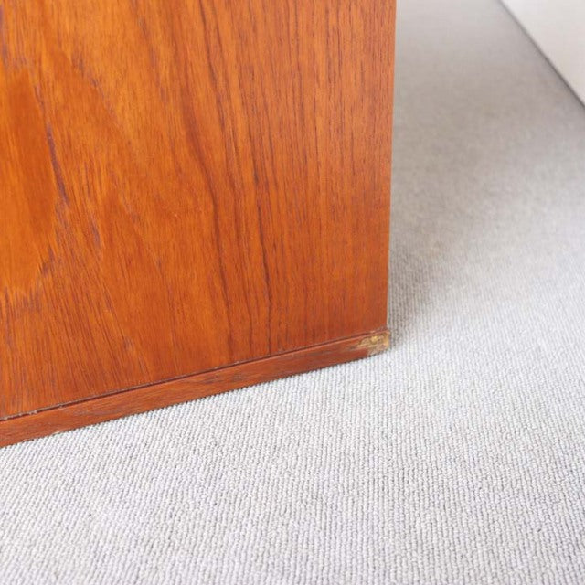 Close-up of vintage teak sideboard corner showing rich wood grain and British mid-century craftsmanship from Avalon.