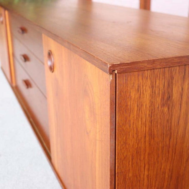 Mid-century British vintage teak sideboard by Avalon, showcasing rich wood grain and minimalist design.