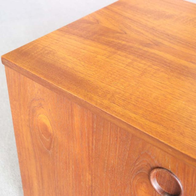 Vintage teak mid-century AVALON sideboard corner showing rich wood grain and rounded recessed handle, British-Denmark design.