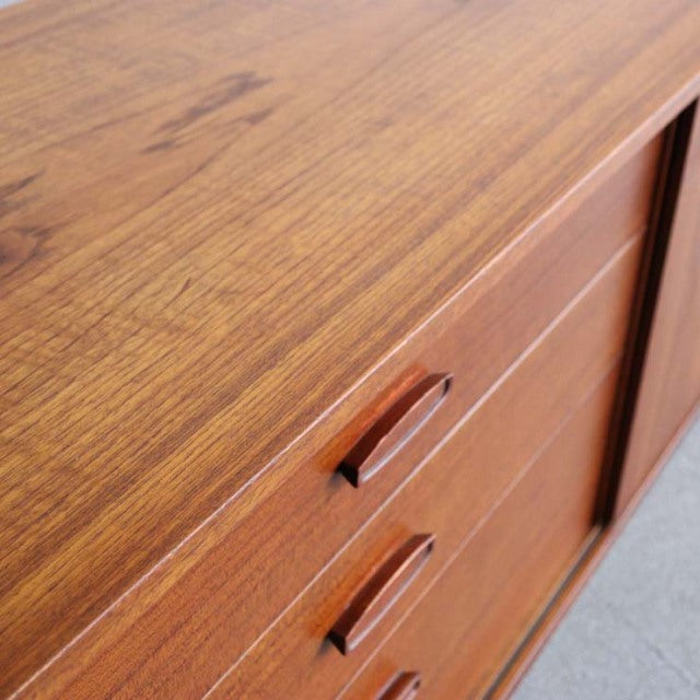 Vintage teak AVALON sideboard with smooth wood grain, mid-century British design, and sleek recessed handles.