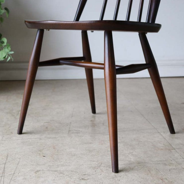 Mid-century British vintage Ercol Goldsmith dining chair in teak with gently tapered legs and smooth wood grain finish.