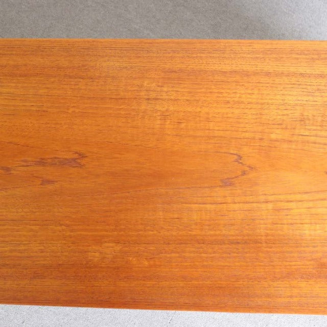 Vintage teak sideboard top panel showing rich wood grain with warm mid-century British and Danish design influences.
